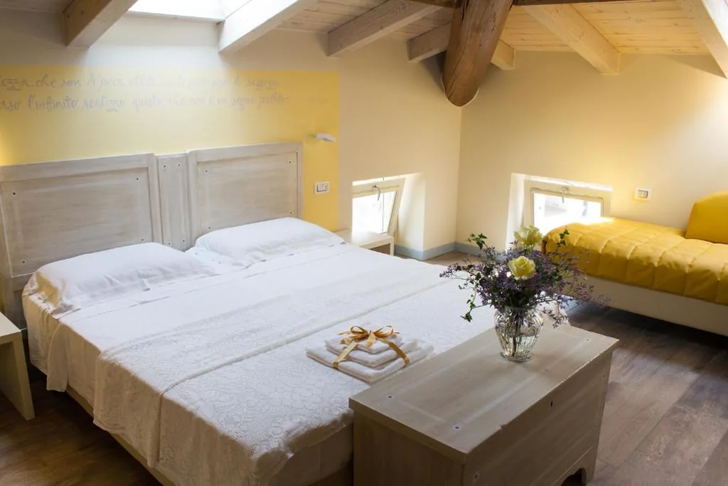 Triple Room with Private Bathroom — Villa di Cazzano – BioLuxury Living