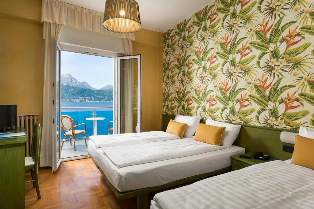 Triple Room with Balcony and Lake View — Hotel Caribe by Double Hospitality