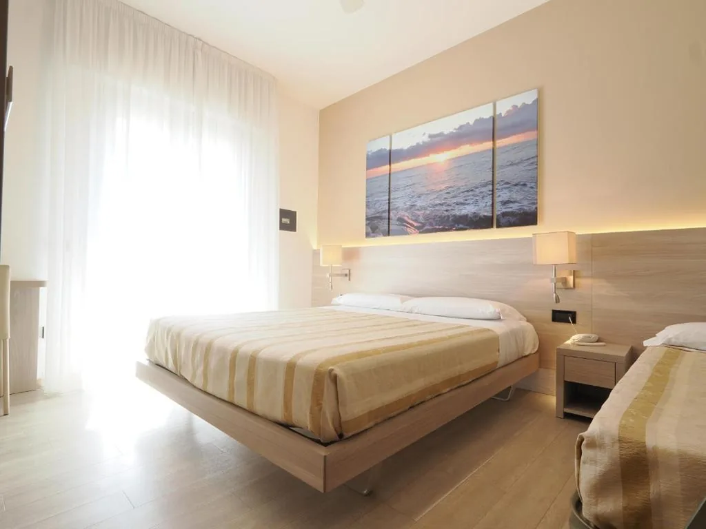 Triple Room with Balcony — Hotel Angelo