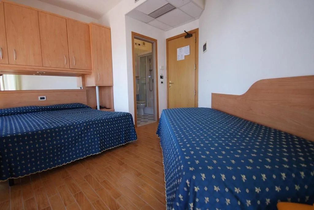 Triple Room with Balcony — Hotel Bellevue
