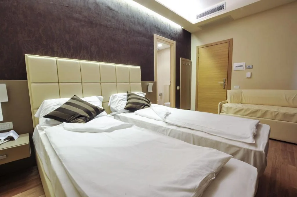 Triple Room with Balcony — Hotel Dori