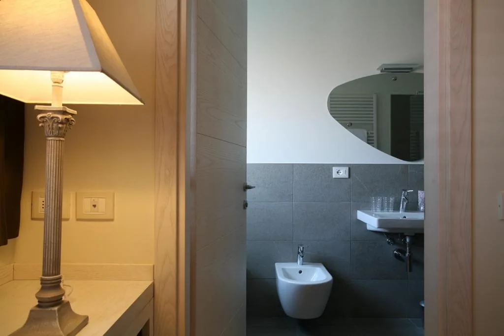 Camera Tripla con Balcone — Nuova Opera Rooms & Apartments