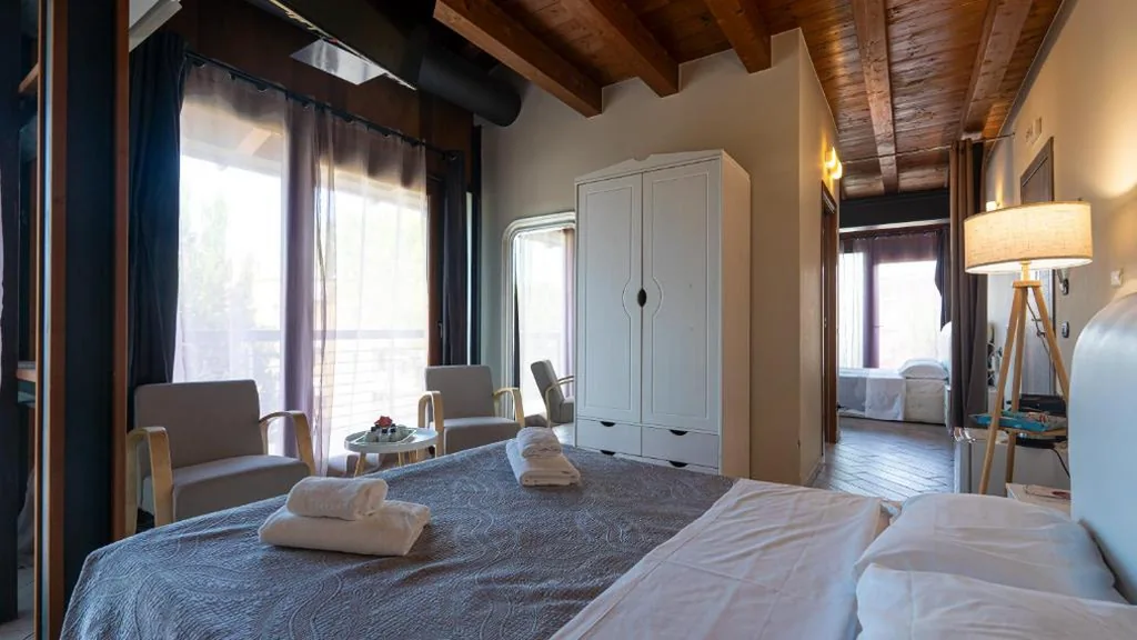Camera Tripla con Vista Giardino — La Terrazza sul Lago