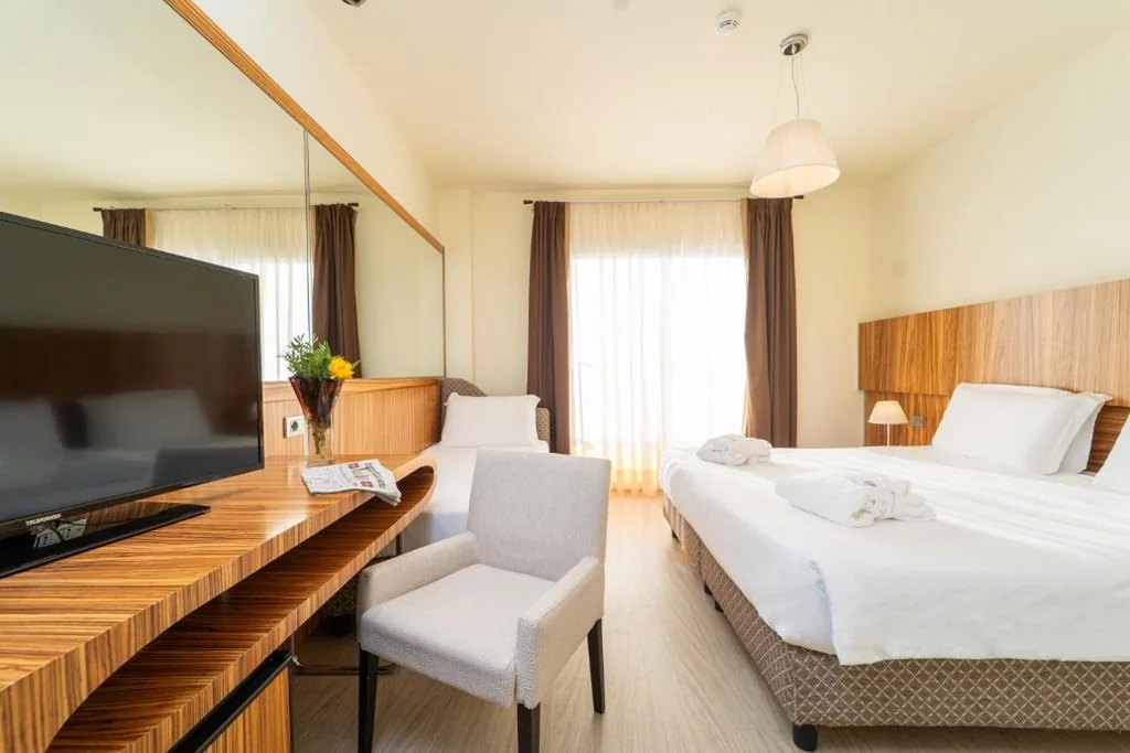 Camera Tripla con Vista Mare Laterale — Bibione Palace Hotel