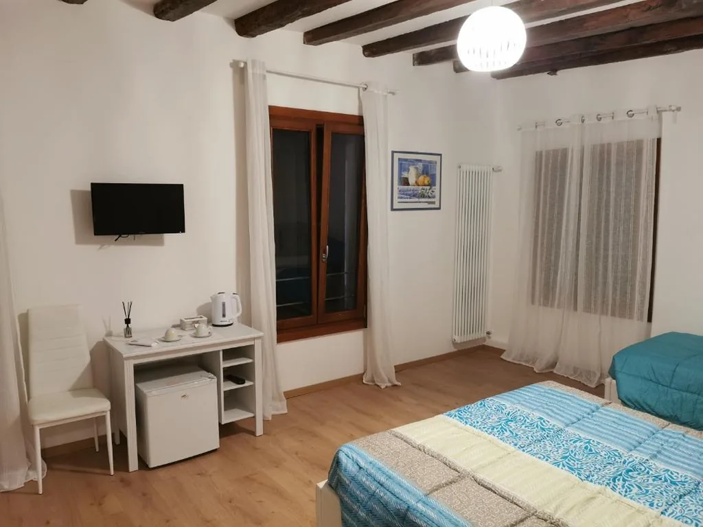 Deluxe Triple Room — Casa Venier