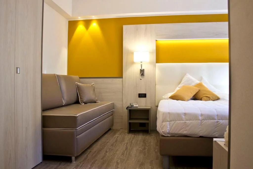 Deluxe Triple Room with Balcony — Hotel Dolomiti