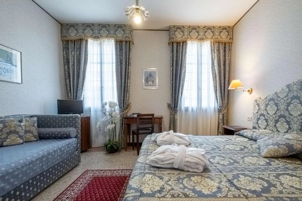 Camera Tripla Deluxe — Hotel La Meridiana