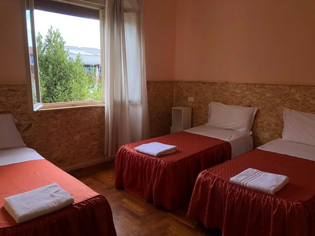 Economy Triple Room with Shared Bathroom — Venice Treviso Airport Bed