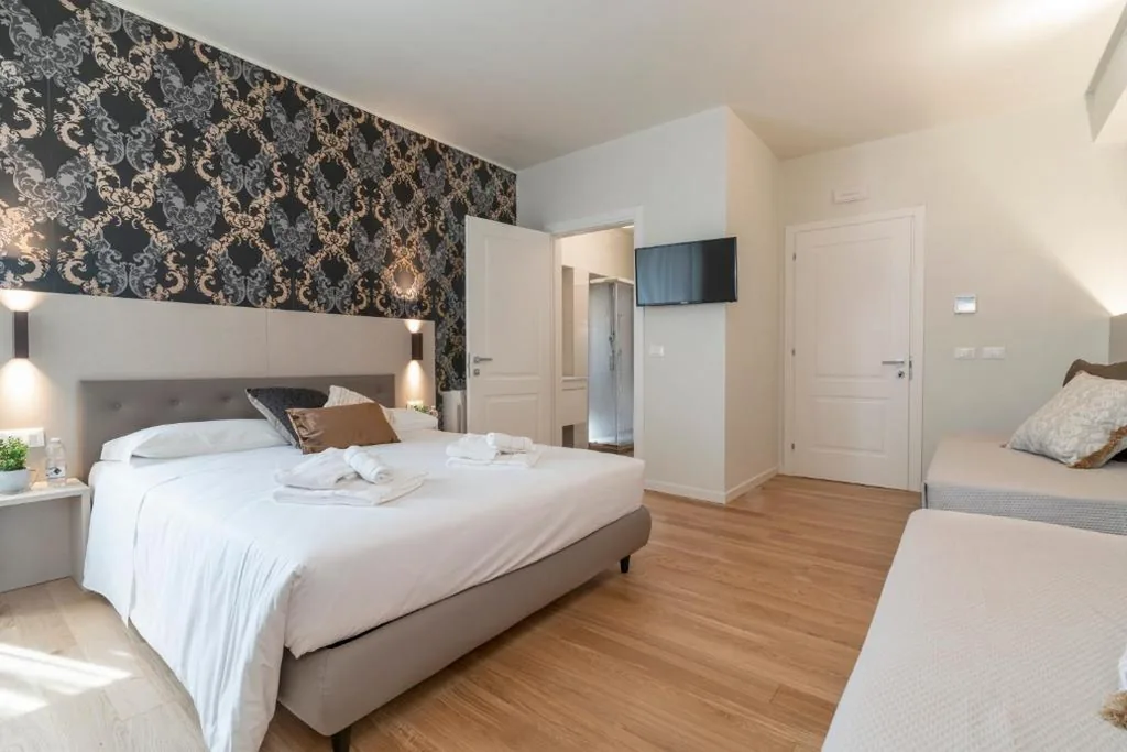 Camera Tripla Luxury — Hotel Grifoni