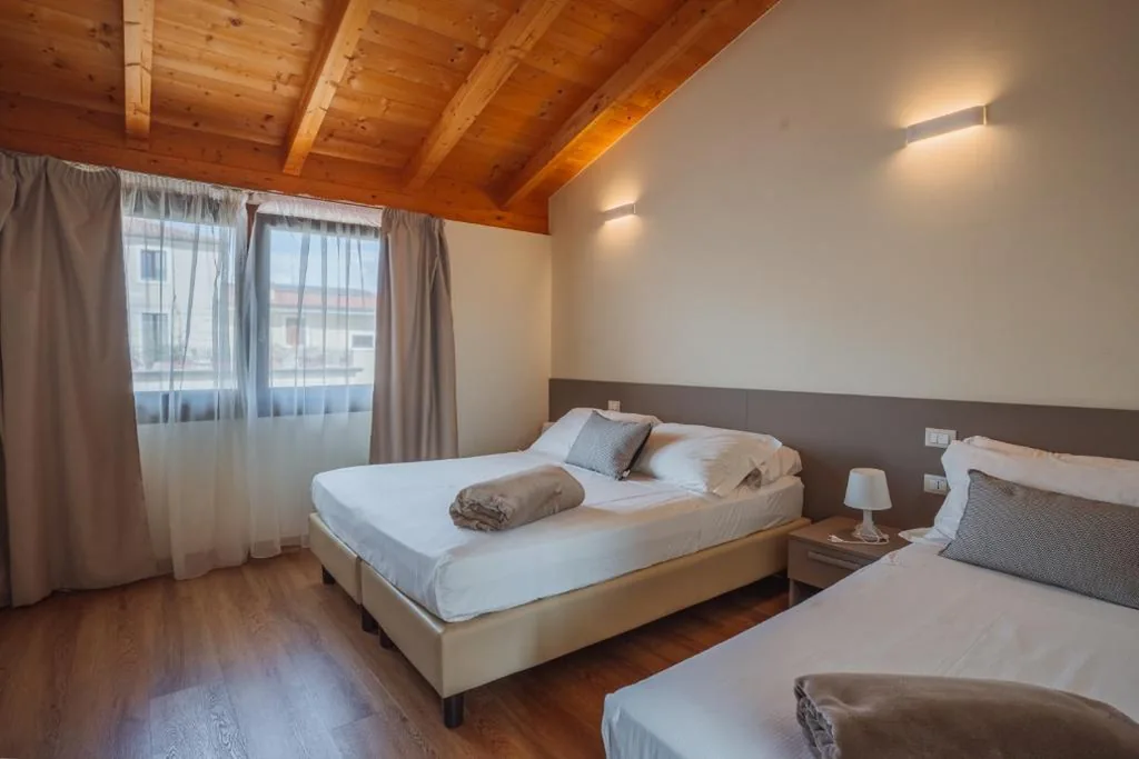 Superior Triple Room with Garden View — Garda Relais