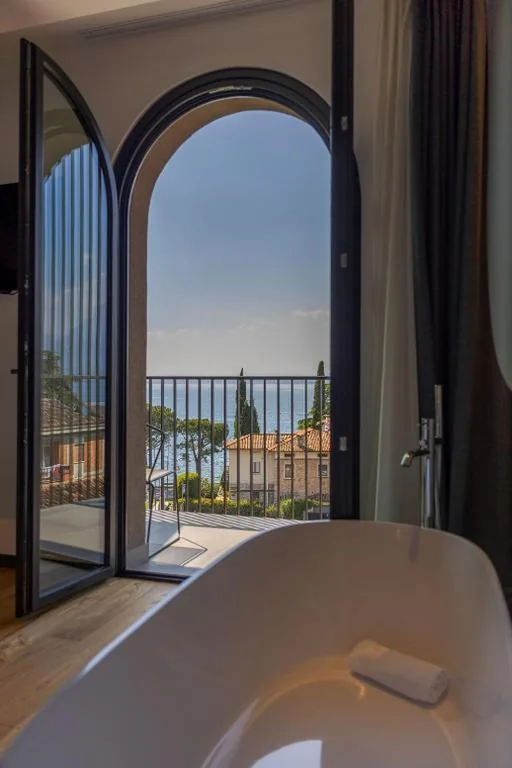King Suite with Terrance and Lake View - Non-Smoking — Hotel Al Caminetto – Adults Only, WorldHotels Crafted